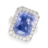 A CEYLON NO HEAT SAPPHIRE AND DIAMOND RING set with an emerald cut blue sapphire of 13.49 carats