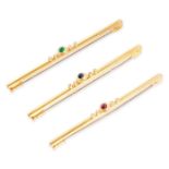 CARTIER, THREE VINTAGE RUBY, EMERALD, SAPPHIRE AND DIAMOND BAR BROOCHES in 18ct yellow gold, each