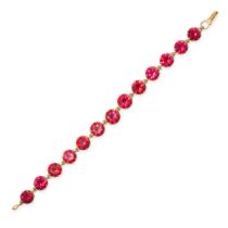A SYNTHETIC RUBY BRACELET in yellow gold, set with thirteen round cut synthetic rubies totalling