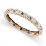 AN ANTIQUE SAPPHIRE AND DIAMOND BANGLE in yellow and white gold, set with cushion cut sapphires