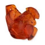 AN AMBER PENDANT comprising of a single piece of amber, carved as an animal on a leaf, 5.0cm, 9.1g.