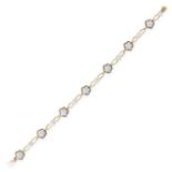 A VINTAGE DIAMOND BRACELET in 18ct yellow gold, set with seven diamond clusters alternating with