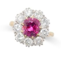 A RUBY AND DIAMOND CLUSTER RING in 18ct yellow gold, set with a cushion ruby of 3.27 carats within a