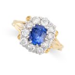 A SAPPHIRE AND DIAMOND CLUSTER RING in 18ct yellow gold, set with a central cushion cut sapphire