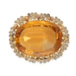 AN ANTIQUE CITRINE BROOCH set with an oval cut citrine within a foliate border, no assay marks, 3.