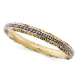 AN ANTIQUE ENAMEL BANGLE, 19TH CENTURY in yellow gold, with a central band of blue enamel accented