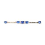 A SAPPHIRE AND DIAMOND BAR BROOCH, EARLY 20TH CENTURY set with five cushion cut sapphires,