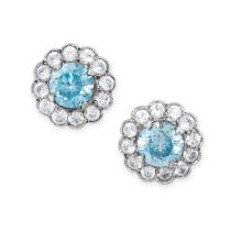 A PAIR OF BLUE ZIRCON AND WHITE GEMSTONE CLUSTER EARRINGS each set with a round cut blue zircon in a
