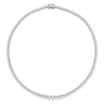 A DIAMOND LINE NECKLACE in platinum, formed of a series of graduated drop shaped links set