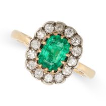AN EMERALD AND DIAMOND CLUSTER RING, EARLY 20TH CENTURY in yellow and silver, set  with a step cut
