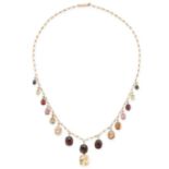 AN ANTIQUE GEMSET HARLQEUIN NECKLACE in yellow gold, the chain suspending a fringe of sixteen