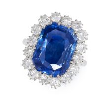 A CEYLON SAPPHIRE AND DIAMOND CLUSTER RING in 18ct white gold, set with an octagonal mixed cut