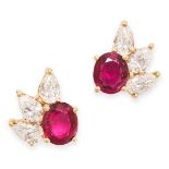 A PAIR OF RUBY AND DIAMOND STUD EARRINGS in 18ct yellow gold, each set with a cushion cut ruby