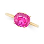 A SYNTHETIC RUBY RING in yellow gold, set with a cushion cut synthetic ruby, no assay marks, size