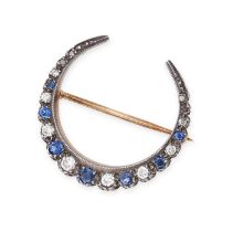 AN ANTIQUE SAPPHIRE AND DIAMOND CRESCENT MOON BROOCH in yellow gold and silver, set with alternating