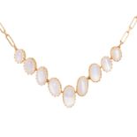 A FRENCH MOONSTONE NECKLACE in 18ct yellow gold, comprising a fancy link chain set with nine oval