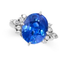 A FINE SAPPHIRE AND DIAMOND RING in platinum, set with a cushion cut blue sapphire of 6.75 carats