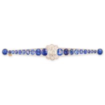 AN ART DECO SAPPHIRE AND DIAMOND BAR BROOCH in yellow gold and platinum, the tapering bar set with a