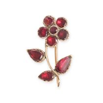 AN ANTIQUE GARNET FLOWER BROOCH in yellow gold, designed as a flower, set with round cut and pear