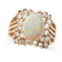 A VINTAGE OPAL AND DIAMOND RING in 14ct yellow gold, set with a cabochon opal, accented by round cut
