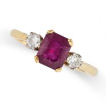 A RUBY AND DIAMOND RING in 18ct yellow gold, set with an emerald cut ruby of 1.75 carats, accented