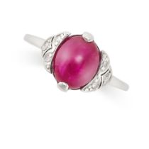 A RUBY AND DIAMOND RING in 18ct white gold, set with a cabochon ruby of 3.30 carats accented by