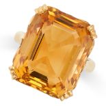 A VINTAGE CITRINE RING in 22ct yellow gold, set with an emerald cut citrine of 25.32 carats, stamped
