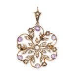 AN ANTIQUE AMETHYST AND PEARL PENDANT / BROOCH in 9ct yellow gold, designed as a flower in