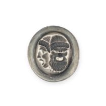 NO RESERVE - A SILVER INTAGLIO depicting a double mask of a bearded slave and Bacchant, 2.0cm, 6.6g.