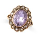 AN AMETHYST AND PEARL RING set with an oval cut amethyst in a border of seed pearls, stamped 9ct,