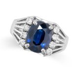 A SAPPHIRE AND DIAMOND DRESS RING set with a cushion cut sapphire of 4.10 carats, accented by