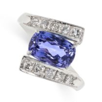 A TANZANITE AND DIAMOND CROSSOVER RING set with a cushion cut tanzanite of 2.53 carats accented by