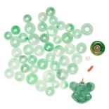 A COLLECTION OF JADEITE JADE DISCS AND A CARVED PENDANT comprising polished jadeite jade discs and a