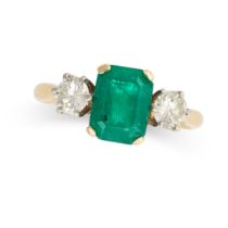 AN EMERALD AND DIAMOND THREE STONE RING in 18ct yellow gold, set with an emerald cut emerald between