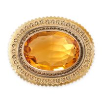 AN ANTIQUE CITRINE BROOCH set with an oval cut citrine within a twisted wirework border, no assay