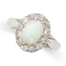 AN OPAL AND DIAMOND CLUSTER RING in 18ct white gold, set with a cabochon opal in a cluster of