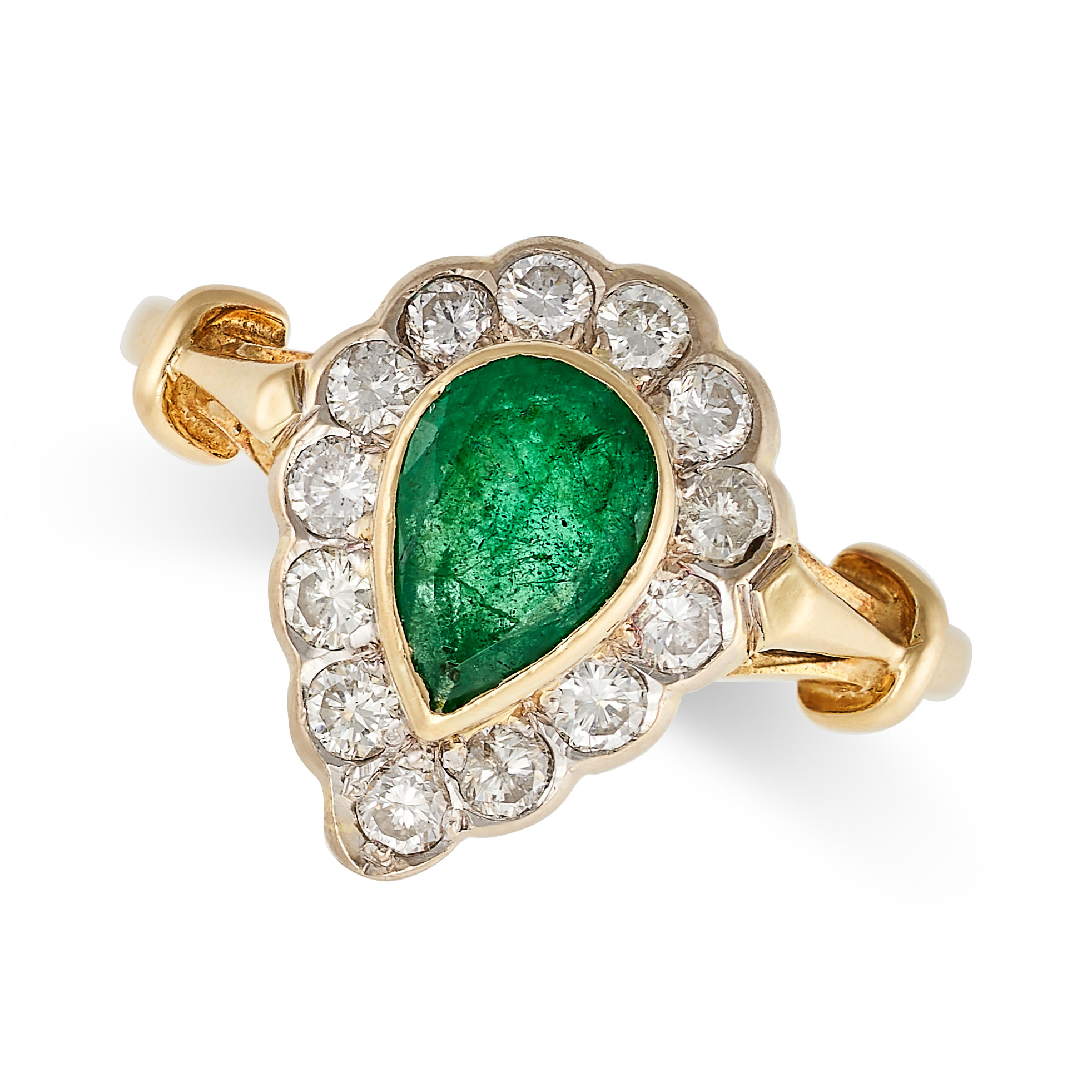 AN EMERALD AND DIAMOND RING in 18ct yellow gold, set with a pear shaped emerald in a cluster of