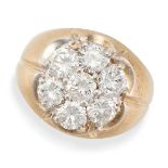 A DIAMOND CLUSTER DRESS RING in yellow gold, set with seven round brilliant cut diamonds, the