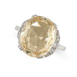 AN UNHEATED YELLOW SAPPHIRE AND DIAMOND RING in platinum, set with a cushion cut yellow sapphire