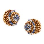 A PAIR OF VINTAGE SAPPHIRE AND DIAMOND CLIP EARRINGS in yellow gold, the stylised spined bodies