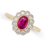 A RUBY AND DIAMOND CLUSTER RING set with an oval cut ruby in a cluster of round brilliant cut