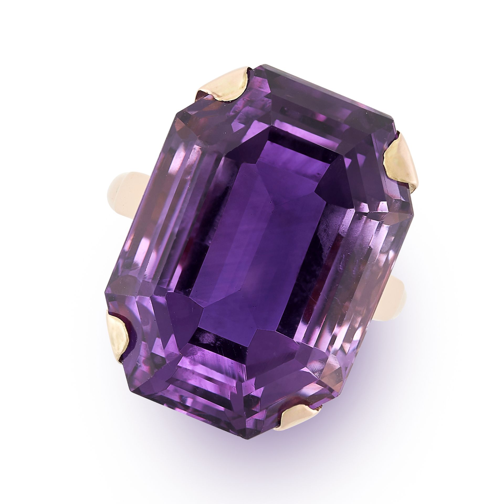 A VINTAGE AMETHYST RING set with an emerald cut amethyst of 23.96 carats, stamped 14ct, size O /