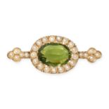 A GREEN PASTE AND PEARL BROOCH in yellow gold, set with an oval cut green paste gemstone in a border