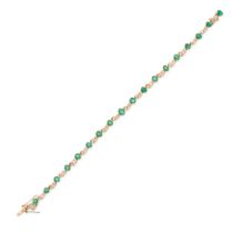 A VINTAGE EMERALD AND DIAMOND BRACELET in yellow gold, set with a row of oval cut emeralds and round