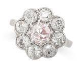 A PINK AND WHITE DIAMOND CLUSTER RING set with an old cut pink diamond of 0.95 carats, in a