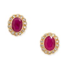 A PAIR OF RUBY AND DIAMOND STUD EARRINGS in 18ct yellow gold, each set with an oval cut ruby