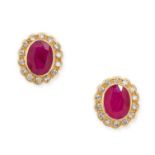 A PAIR OF RUBY AND DIAMOND STUD EARRINGS in 18ct yellow gold, each set with an oval cut ruby