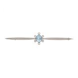 AN ANTIQUE AQUAMARINE AND DIAMOND BAR BROOCH in 15ct gold, set with an oval cut aquamarine in a