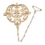 AN ANTIQUE EDWARDIAN PEARL AND DIAMOND BROOCH / PENDANT in 15ct yellow gold, in scrolling foliate