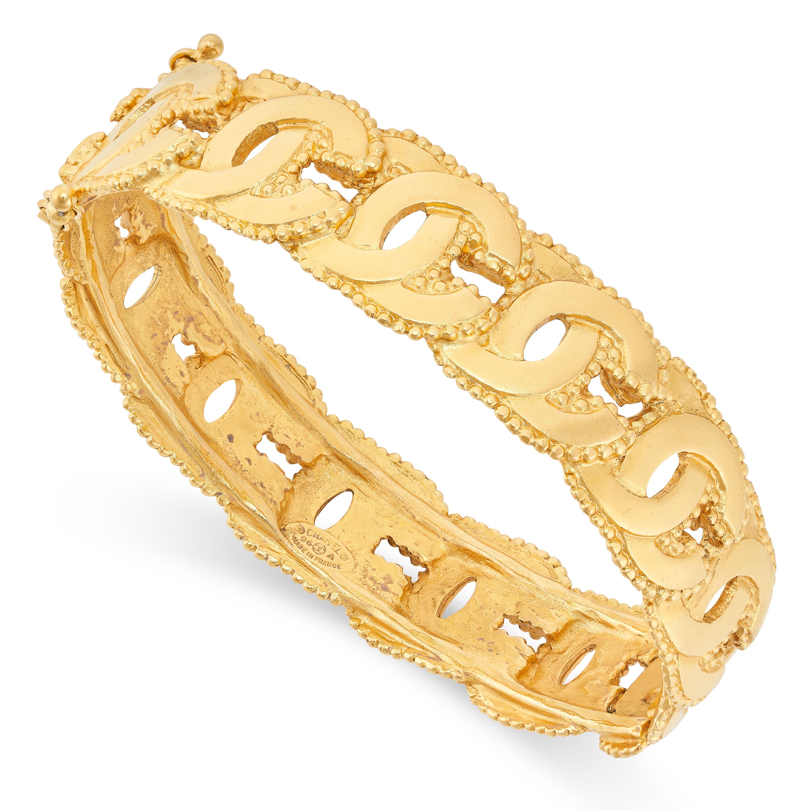 CHANEL, A VINTAGE CC BANGLE the bangle comprising a series of interlocking C motifs with beaded